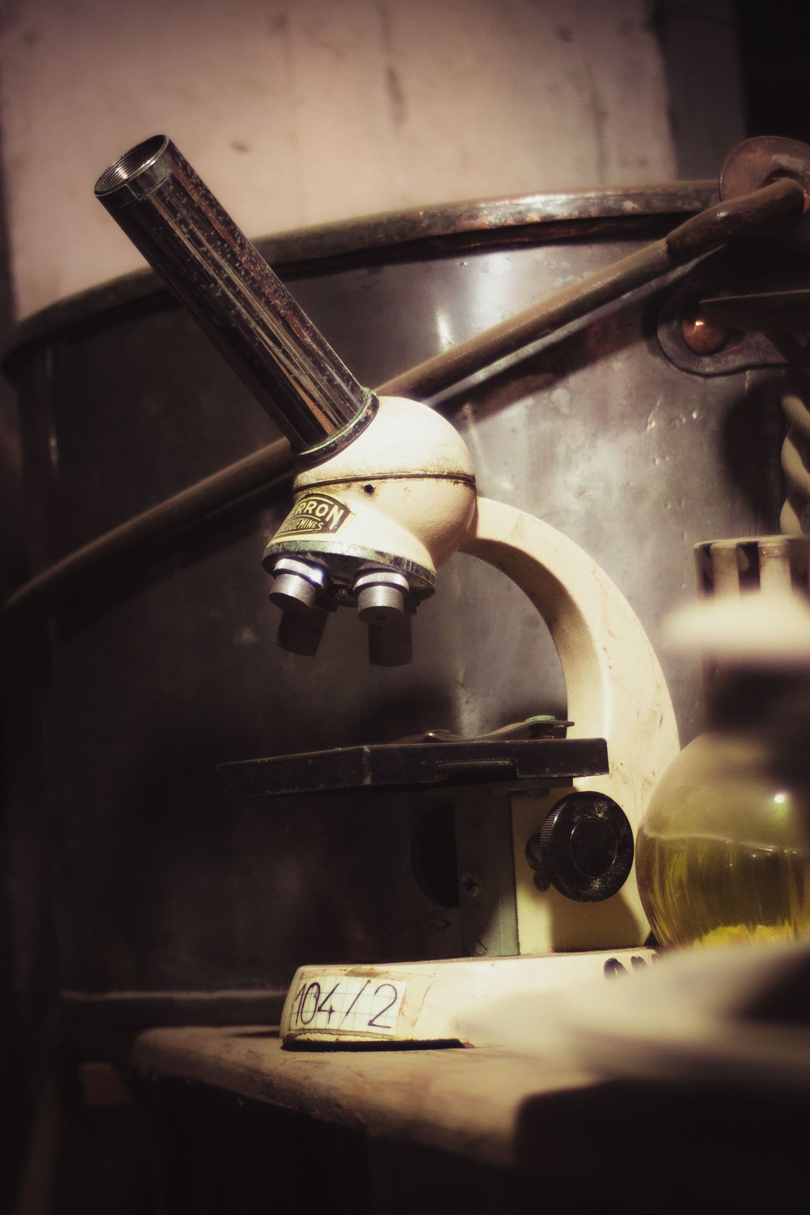 Vintage microscope in an old laboratory — a century of refractory science